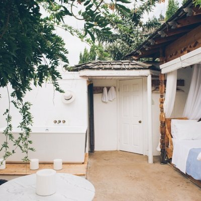 The bed in the roofless room.